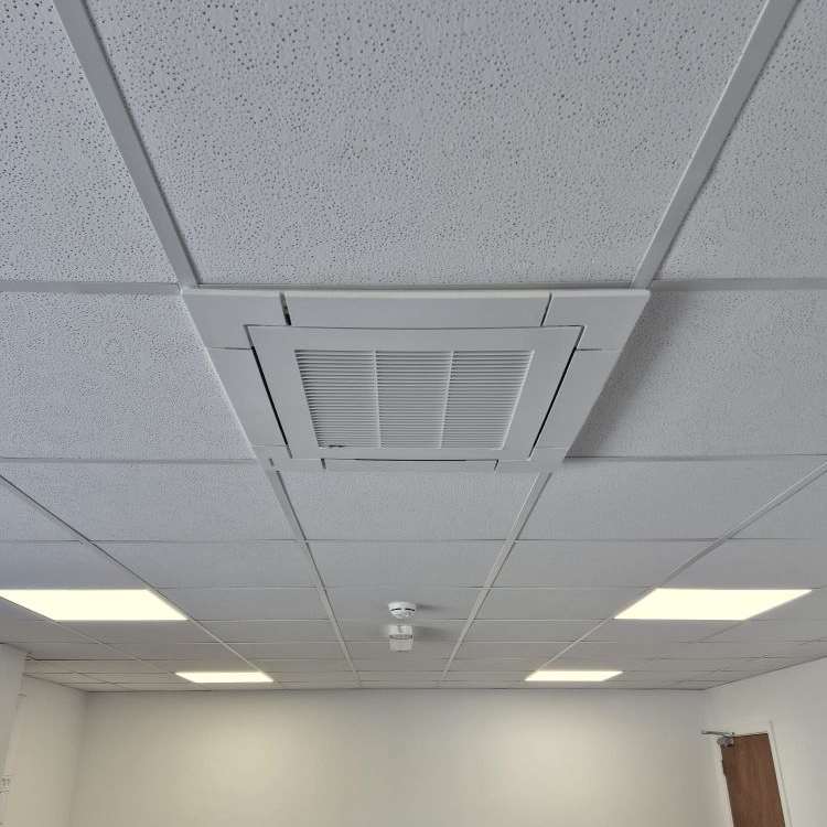 Ceiling cassette air conditioning unit installed in suspended office ceiling