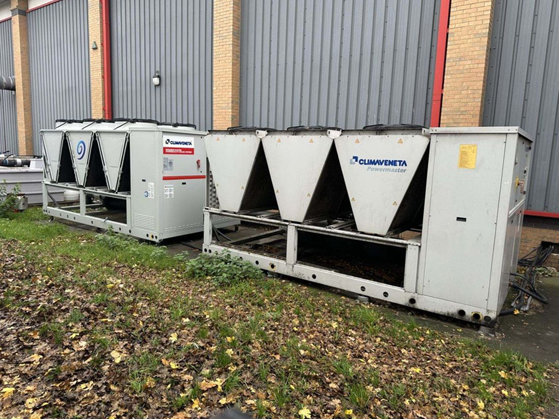 Pair of Climaveneta Powermaster industrial air-cooled chillers on manufacturing site